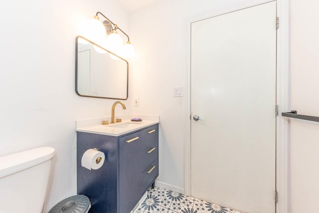 500 Little Lake Dr # 1, Ann Arbor, MI 48103 - bathroom with vanity, toilet, and tile patterned floors