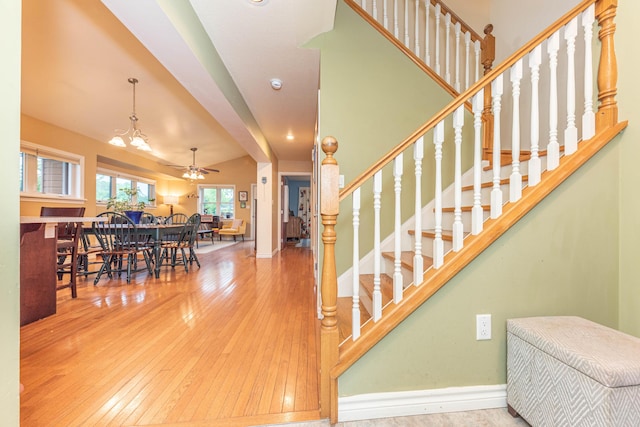 500 Little Lake Dr # 1, Ann Arbor, MI 48103 - stairway with wood-type flooring, ceiling fan, and baseboards
