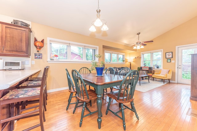 500 Little Lake Dr # 1, Ann Arbor, MI 48103 - dining room with light wood-style flooring, lofted ceiling, baseboards, and a ceiling fan