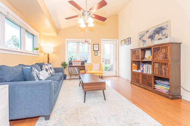 500 Little Lake Dr # 1, Ann Arbor, MI 48103 - living room with wood finished floors, a ceiling fan, vaulted ceiling, and baseboards