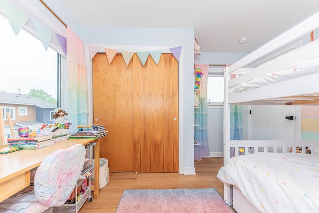 500 Little Lake Dr # 1, Ann Arbor, MI 48103 - bedroom featuring wood finished floors