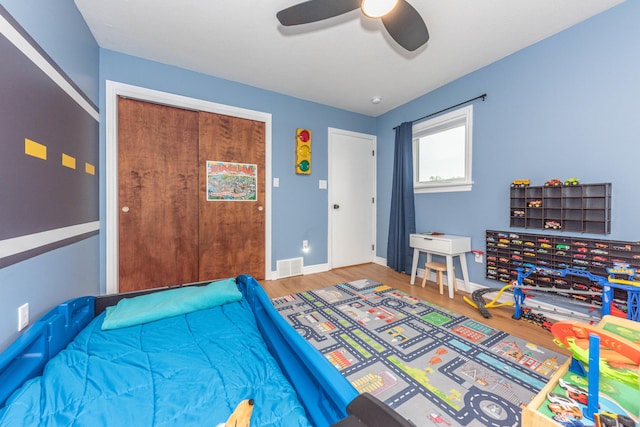 500 Little Lake Dr # 1, Ann Arbor, MI 48103 - bedroom featuring wood finished floors, baseboards, and ceiling fan
