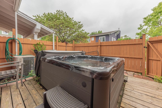 500 Little Lake Dr # 1, Ann Arbor, MI 48103 - wooden terrace featuring a hot tub and cooling unit