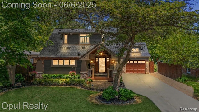716 Magnolia Ave, Royal Oak, MI 48073 - view of front of property featuring a garage, concrete driveway, and stone siding
