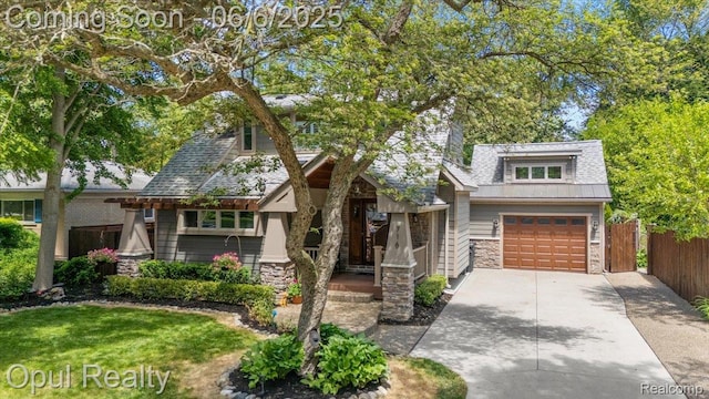 716 Magnolia Ave, Royal Oak, MI 48073 - view of front of home featuring stone siding, driveway, and an attached garage