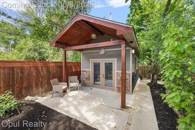 716 Magnolia Ave, Royal Oak, MI 48073 - fenced backyard with french doors, a patio area, and an outdoor structure