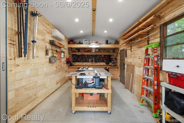 716 Magnolia Ave, Royal Oak, MI 48073 - misc room with a workshop area, wood walls, vaulted ceiling, a wall mounted AC, and concrete floors