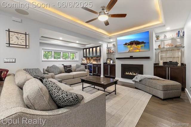 716 Magnolia Ave, Royal Oak, MI 48073 - living room with a tray ceiling, wine cooler, a ceiling fan, bar, and wood finished floors