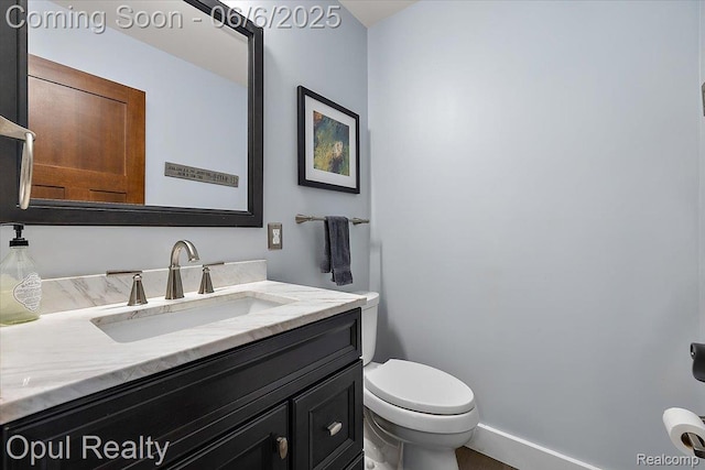 716 Magnolia Ave, Royal Oak, MI 48073 - half bath featuring vanity, toilet, and baseboards