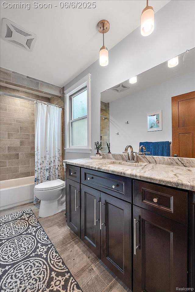 716 Magnolia Ave, Royal Oak, MI 48073 - bathroom with vanity, toilet, shower / bath combo with shower curtain, and wood finished floors