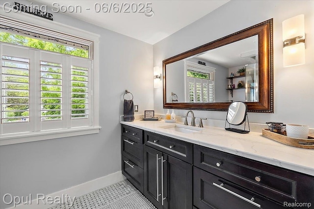 716 Magnolia Ave, Royal Oak, MI 48073 - bathroom with baseboards, vanity, and tile patterned floors