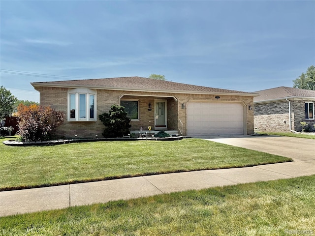 7411 N Farmington Rd, Westland, MI 48185 - ranch-style home with brick siding, a garage, driveway, and a front lawn