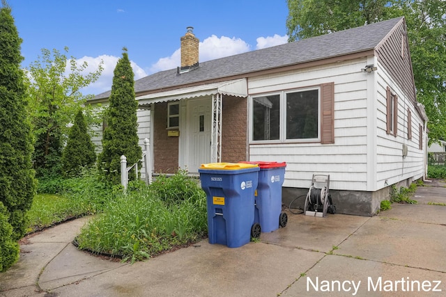 853 California St NW, Grand Rapids, MI 49504 - bungalow featuring a chimney