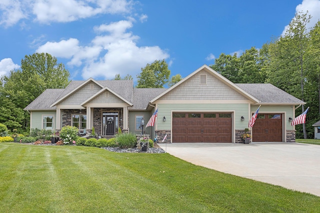 33515 28th Ave, Paw Paw, MI 49079 - craftsman inspired home featuring stone siding, a garage, concrete driveway, a front yard, and roof with shingles