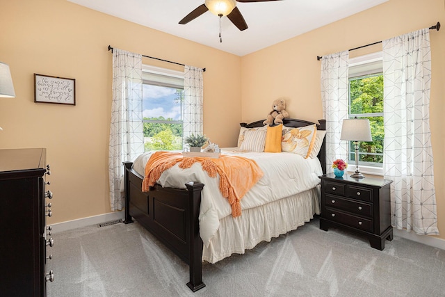 33515 28th Ave, Paw Paw, MI 49079 - carpeted bedroom featuring multiple windows, baseboards, and a ceiling fan