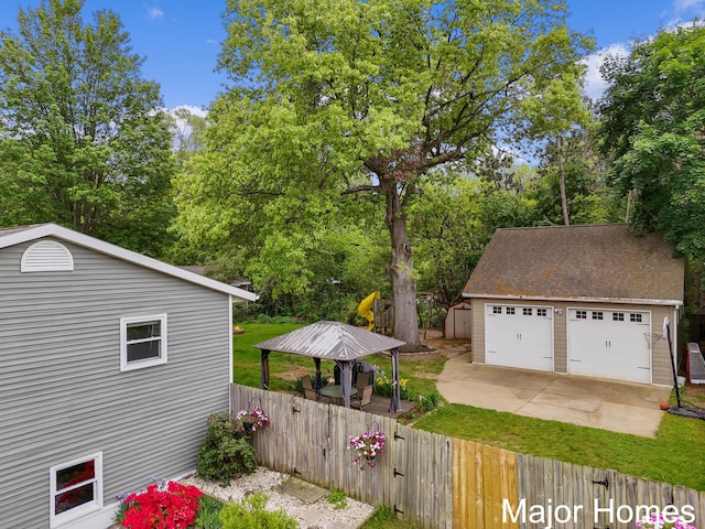 1724 Sandra St NW, Grand Rapids, MI 49544 - view of property exterior featuring an outdoor structure, a garage, and view of scattered trees