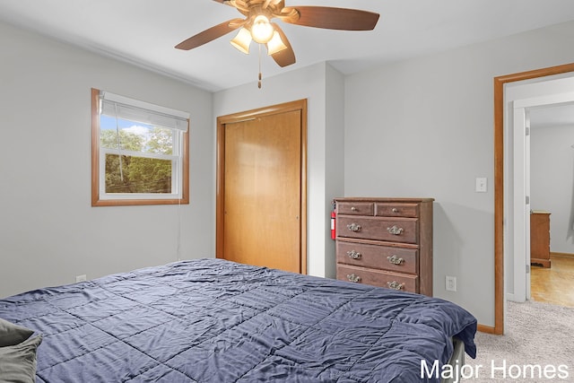 1724 Sandra St NW, Grand Rapids, MI 49544 - bedroom featuring carpet floors, baseboards, ceiling fan, and a closet