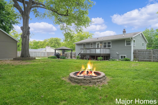 1724 Sandra St NW, Grand Rapids, MI 49544 - view of yard featuring a gazebo, an outdoor fire pit, and a deck