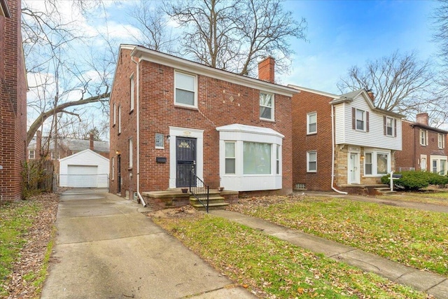 17217 Plainview Ave, Detroit, MI 48219 - townhome / multi-family property featuring an outbuilding, a chimney, brick siding, and a garage