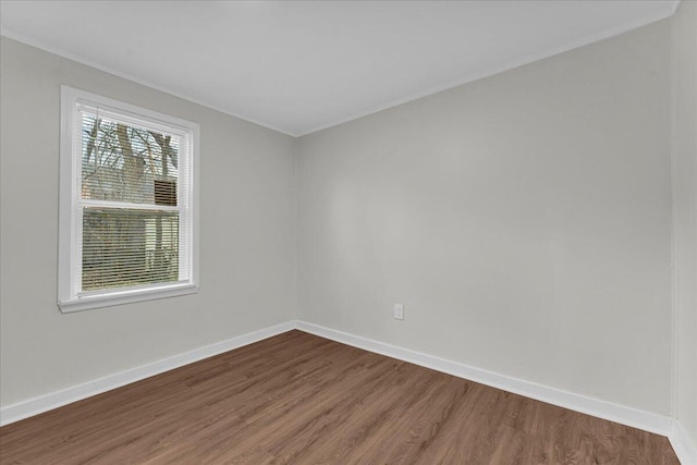 17217 Plainview Ave, Detroit, MI 48219 - spare room featuring dark wood finished floors, baseboards, and crown molding