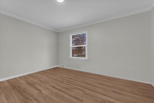 17217 Plainview Ave, Detroit, MI 48219 - empty room featuring ornamental molding, light wood finished floors, and baseboards