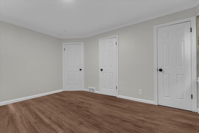 17217 Plainview Ave, Detroit, MI 48219 - unfurnished bedroom featuring wood finished floors and baseboards