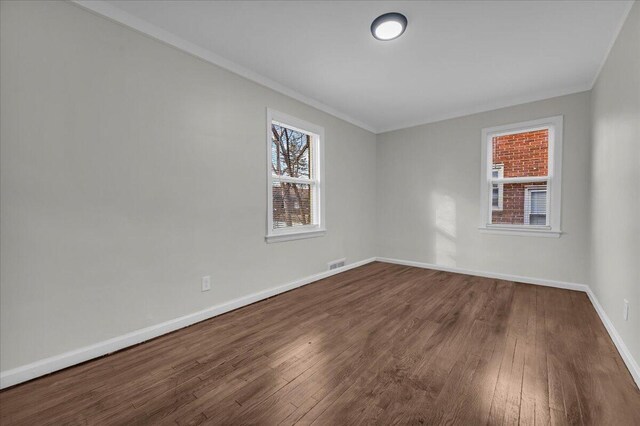 17217 Plainview Ave, Detroit, MI 48219 - empty room with ornamental molding, dark wood finished floors, and baseboards