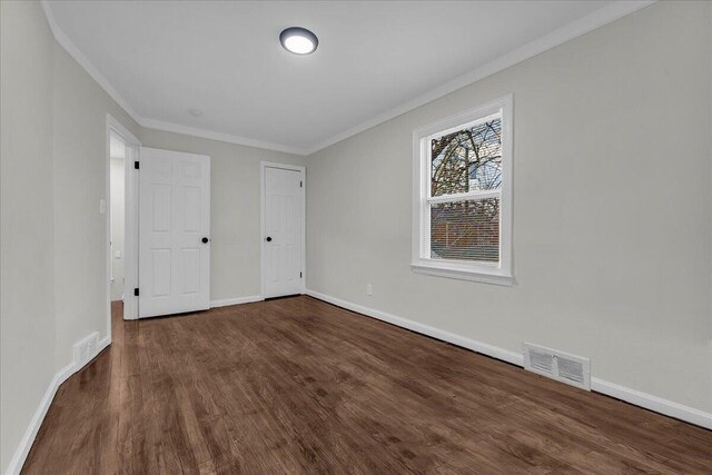 17217 Plainview Ave, Detroit, MI 48219 - unfurnished bedroom with crown molding, dark wood-style flooring, and baseboards