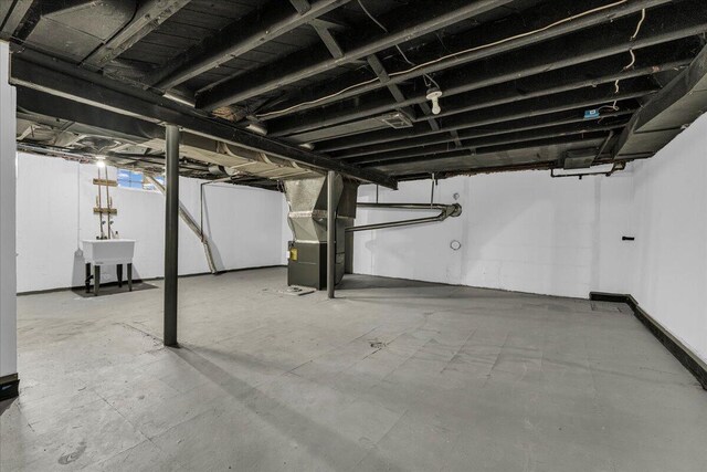 17217 Plainview Ave, Detroit, MI 48219 - unfinished below grade area featuring heating unit and a sink