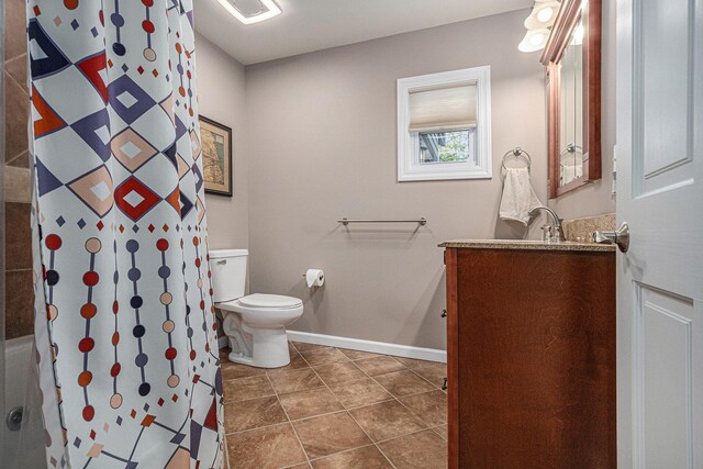 2335 Niles Ave, Saint Joseph, MI 49085 - full bath with vanity, toilet, a shower with curtain, baseboards, and tile patterned floors