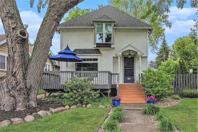 2335 Niles Ave, Saint Joseph, MI 49085 - view of front of home featuring a shingled roof and a deck