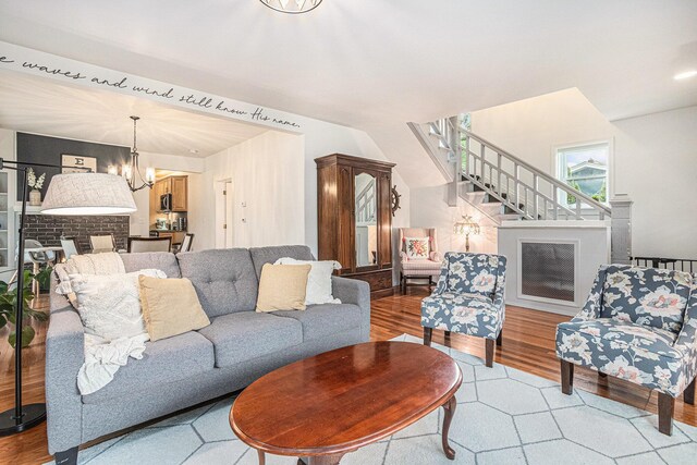 2335 Niles Ave, Saint Joseph, MI 49085 - living room with stairs, light wood-style flooring, and a chandelier
