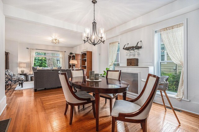 2335 Niles Ave, Saint Joseph, MI 49085 - dining space with a chandelier, light wood-type flooring, and baseboards