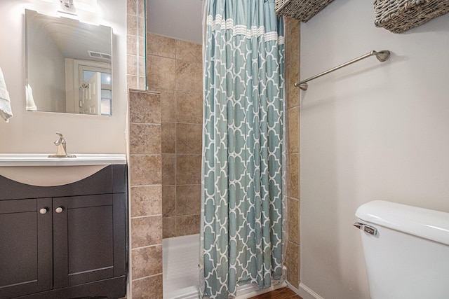 2335 Niles Ave, Saint Joseph, MI 49085 - full bathroom featuring a tile shower, toilet, and vanity