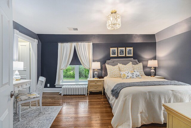 2335 Niles Ave, Saint Joseph, MI 49085 - bedroom with radiator, wood-type flooring, a chandelier, and baseboards