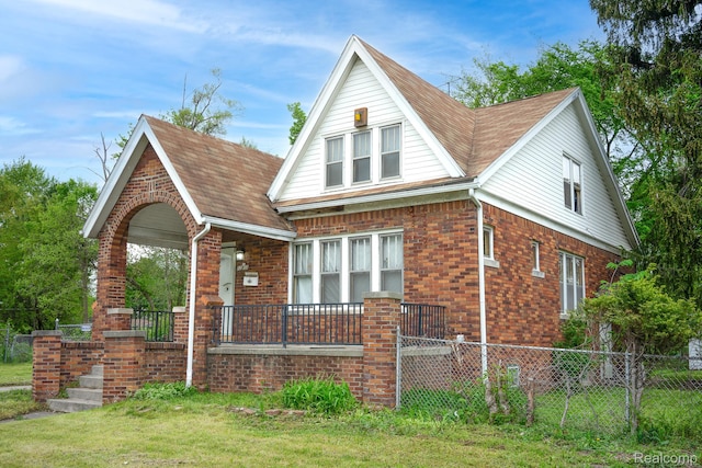 12151 Corbett St, Detroit, MI 48213 - view of front facade featuring brick siding and covered porch