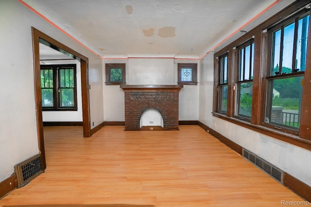 12151 Corbett St, Detroit, MI 48213 - unfurnished living room featuring wood finished floors and baseboards
