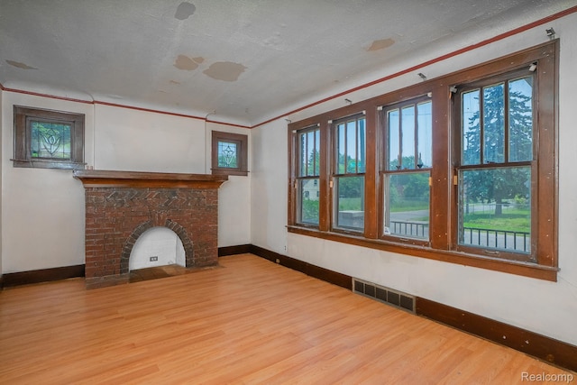 12151 Corbett St, Detroit, MI 48213 - unfurnished living room featuring wood finished floors and crown molding
