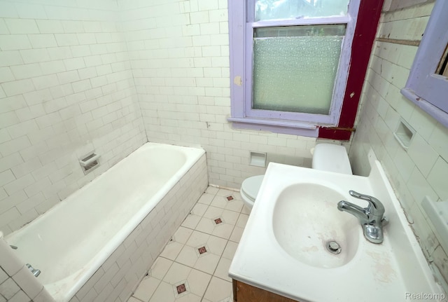 12151 Corbett St, Detroit, MI 48213 - bathroom featuring tile walls, tile patterned flooring, tiled bath, and vanity