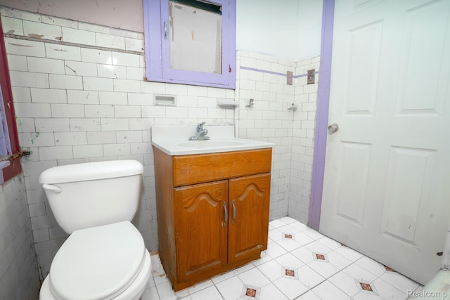 12151 Corbett St, Detroit, MI 48213 - bathroom featuring tile walls, vanity, and tile patterned flooring