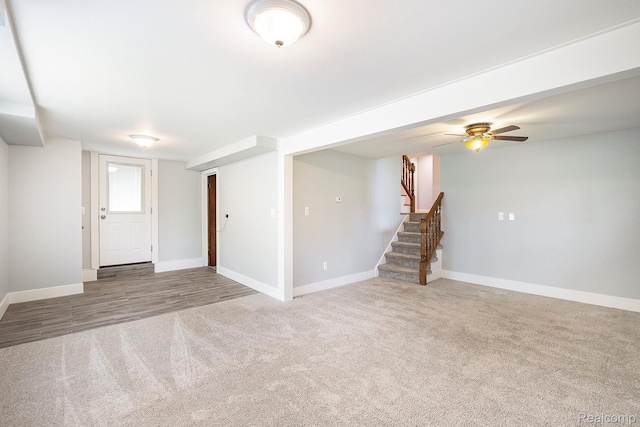 7340 Hartland Rd, Fenton, MI 48430 - foyer entrance with carpet floors, baseboards, stairs, and a ceiling fan