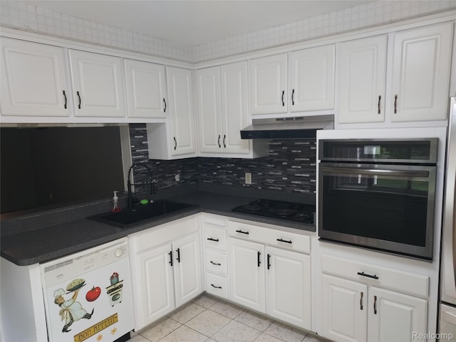 24781 Larkins St, Southfield, MI 48033 - kitchen with oven, dishwasher, black electric stovetop, a sink, and light tile patterned floors