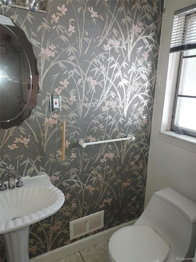 24781 Larkins St, Southfield, MI 48033 - half bathroom with wallpapered walls, toilet, and a sink