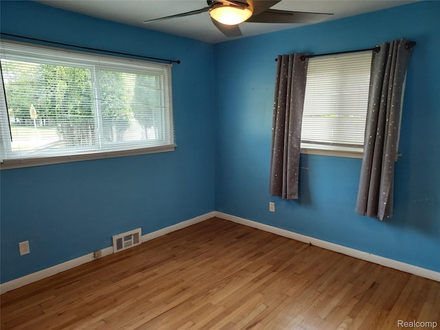 24781 Larkins St, Southfield, MI 48033 - spare room with a ceiling fan, wood finished floors, and baseboards