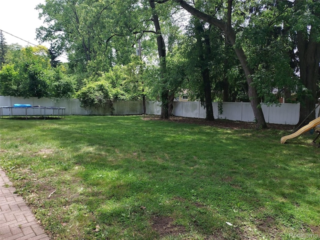 24781 Larkins St, Southfield, MI 48033 - view of yard with a trampoline and a playground