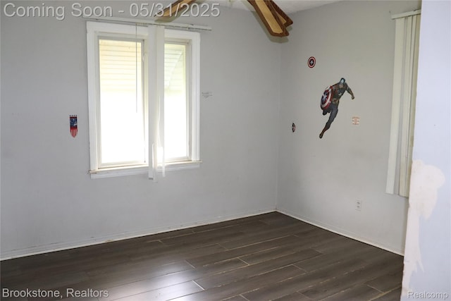 27261 Academy St, Roseville, MI 48066 - empty room featuring dark wood-type flooring and baseboards