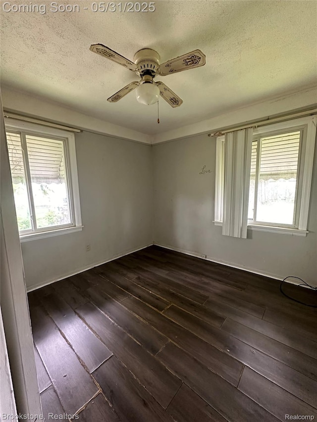 27261 Academy St, Roseville, MI 48066 - spare room with dark wood finished floors, a textured ceiling, and a ceiling fan