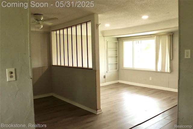 27261 Academy St, Roseville, MI 48066 - spare room featuring dark wood finished floors, a textured ceiling, ceiling fan, baseboards, and recessed lighting