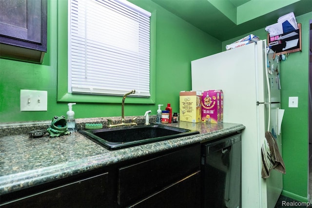 28399 Felician St, Roseville, MI 48066 - kitchen featuring dishwasher, a sink, freestanding refrigerator, and dark countertops
