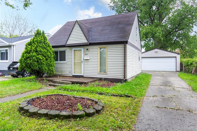 28399 Felician St, Roseville, MI 48066 - view of front facade with an outdoor structure, a garage, a shingled roof, and a front lawn